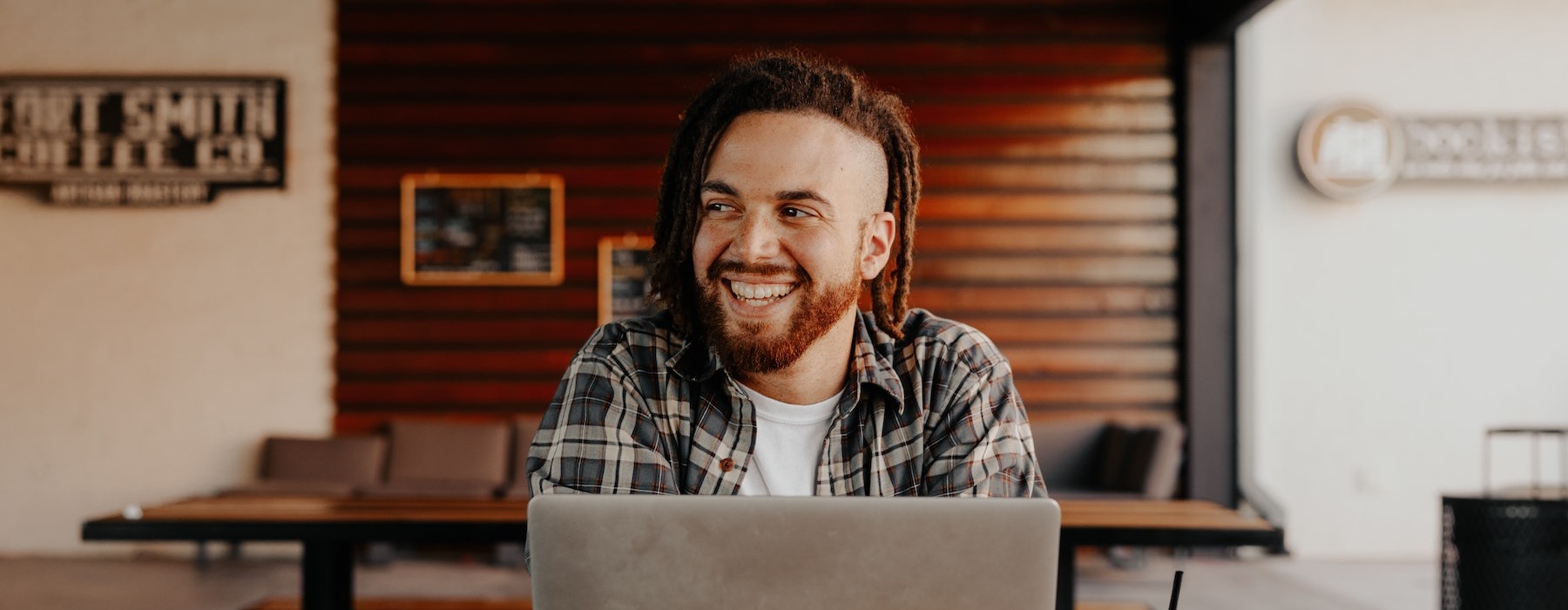 a guy on a laptop smiling